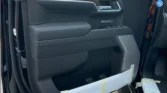 2026 Chevrolet Silverado High Country Midnight Edition 3.0L driver side door panel trim and controls