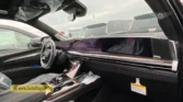2026 Cadillac Escalade ESV passenger-side dashboard and wood-trimmed center console view
