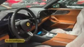 2026 Ferrari Purosangue luxury performance interior tan leather steering wheel and digital driver cockpit view