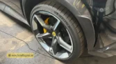 2026 Ferrari Purosangue luxury performance alloy wheel, carbon ceramic brake disc, and yellow brake caliper detail view