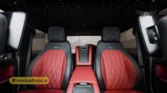 2026 Mercedes-Benz G-Class MBS Edition rear-passenger interior view highlighting the custom red and black quilted leather seats, center console, and starlight headliner