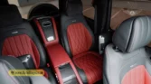 2026 Mercedes-Benz G-Class MBS Edition rear-passenger interior view highlighting the custom red and black quilted leather seats, center console, and headrests