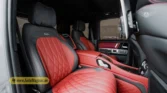 2026 Mercedes-Benz G-Class MBS Edition rear-passenger interior view highlighting the custom red and black quilted leather seats, center console, and headrests