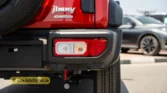 2026 Suzuki Jimny GLX AT rear bumper reflector and bumper-mounted tail light detail closeup