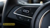 2026 Suzuki Jimny GLX AT steering wheel audio control buttons and MODE switch detail closeup