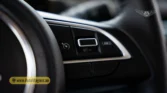2026 Suzuki Jimny GLX AT steering wheel cruise control and SET/CANCEL button detail closeup