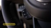 2026 Suzuki Jimny GLX AT steering wheel telephony, voice command, and call management button detail closeup