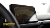2026 Suzuki Jimny GLX AT touchscreen infotainment system displaying the reverse camera view and parking guidelines