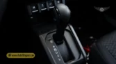 2026 Suzuki Jimny GLX AT center console layout featuring the gear selector and transfer case lever