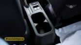 2026 Suzuki Jimny GLX AT rear center console cupholders and storage tray detail closeup situated behind the handbrake lever